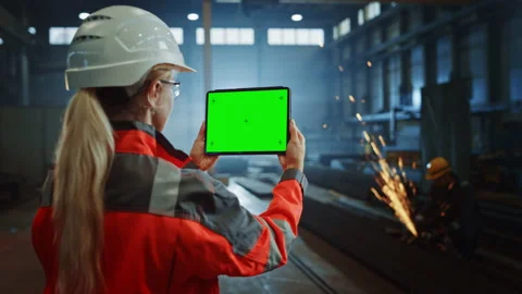 Steel Factory Industrial Engineer Using Tablet with Green Screen Video stock 140594964