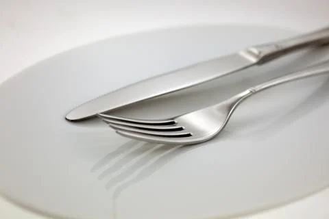 Steel flatware: fork and knife Stock Photos
