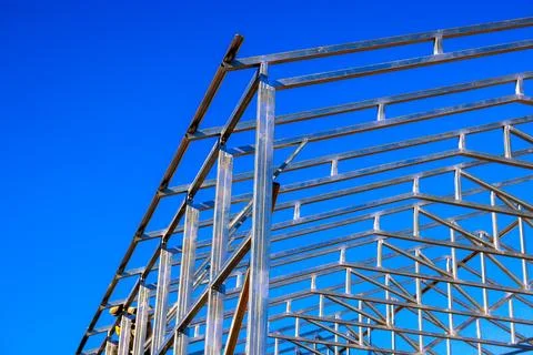 Steel frame beams structure at construction site for new building project Stock Photos