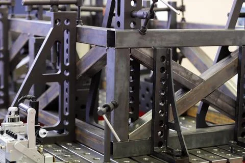 Steel frame on modular welding table with fixtures Stock Photos