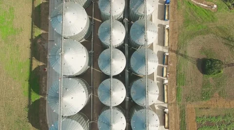 Steel grain silos elevators storage 4k aerial video. Agriculture industry Stock Footage 67321176