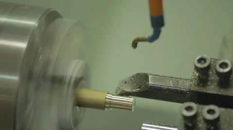 Steel metal cutting machine process by CNC lathe in workshop Stock Footage 64990418