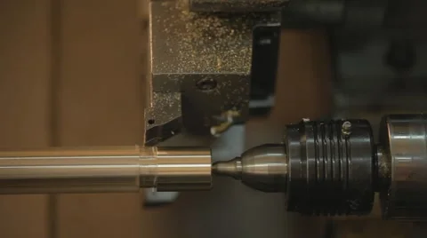 Steel metal cutting machine process by CNC lathe in workshop Stock Footage 65303175