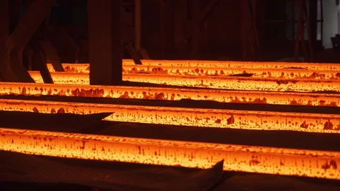 Steel mill, steel bars and pipe production, red-hot pipes transported Stock Footage