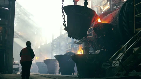 Steel mill worker is observing copper casting Stock Footage 160410385