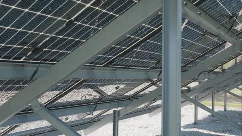 Steel mounting structures for bifacial solar panel array at power farm Stock Footage 334393052
