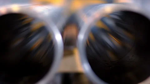 Steel pipe ends rack focus warehouse. Extreme closeup tube bore industry plant. Stock Footage 345677361