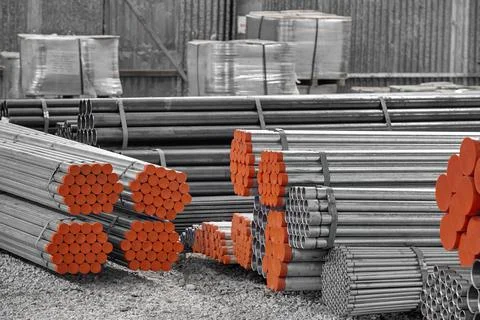 Steel Pipes bunch on the rack in warehouse Stock Photos