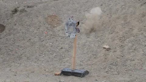 Steel reactive hostage target getting shot at multiple times Video stock 242638728