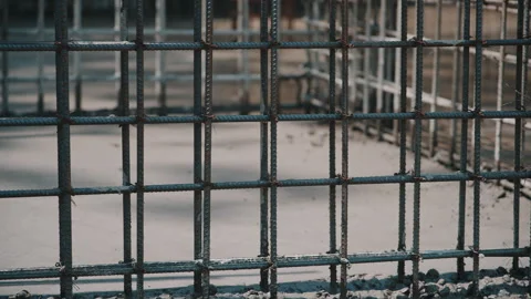 Steel reinforcement structure forms framework of future building. Metal rods Stock Footage 306653073