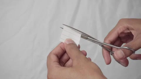 Steel scissors cutting paper Stock Footage 321359045