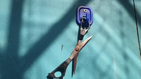 Steel scissors hang on a hook on the wall. Stock Footage 109209633