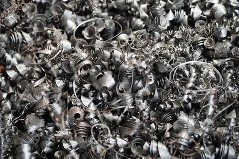 Steel scrap materials recycling. Aluminum chip waste after machining metal pa Stock Photos