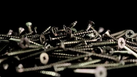 Steel screws falling with black background. Stock Footage 125643459