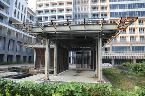 A steel structure canopy with two columns and an entrance gate is under con.. Stock Photos