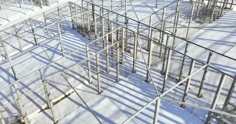 Steel structure with mesh canopy stands on snowy slope Stock Footage 318740388