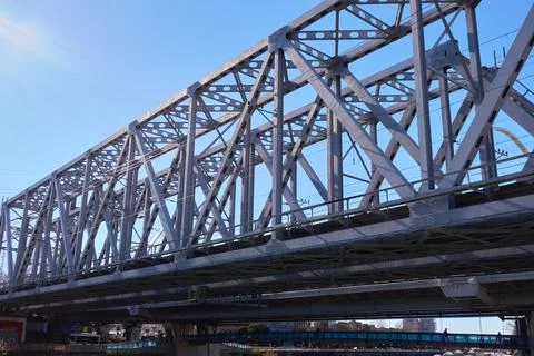 Steel structures of the railway bridge. The railroad runs through the center Stock Photos