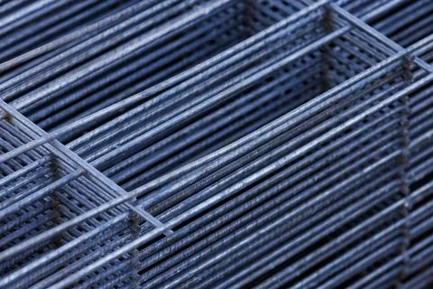 Steel wire mesh panels stacked in construction warehouse. Stock Photos