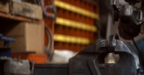 Steel worker with angle grinder making hot glowing sparks Stock Footage 120618400