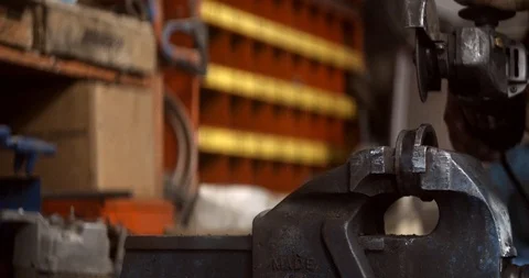 Steel worker with angle grinder making hot glowing sparks Stock Footage 120618412