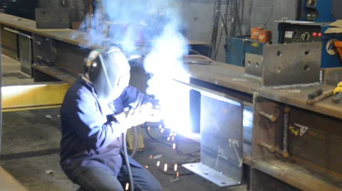 Steel worker welding I-Beam Stock Footage 35696421