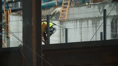 Steel worker welding structure Stock Footage 136807810