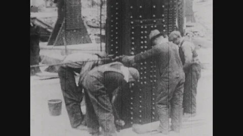 Steel workers constructing the Empire State Building in 1930 Stock Footage 82509765