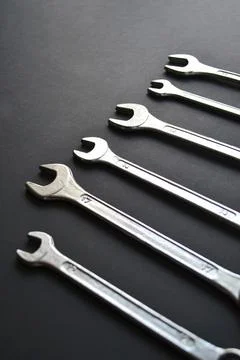 Steel wrenches on black background. Tools banner Stock Photos