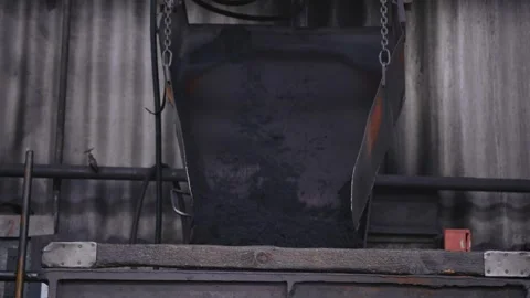 The steelmaking process of introducing sand into the mold for castings. Stock Footage 296546005