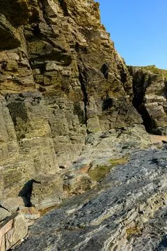 The steep and rocky cliffs of Cap de Carteret Stock Photos