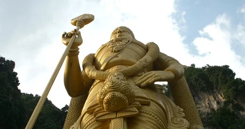 Steep angle on batu caves lord marugan statue Stock Footage 112848198