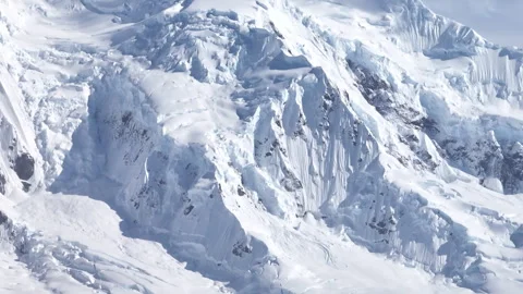 Steep Antarctic mountain slopes covered with ice Stock Footage 337951391