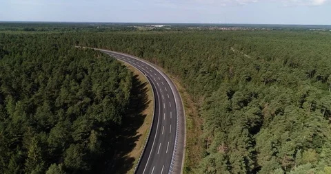 Steep banked road for automotive testing secret track in forest drone aerial 4k Stock Footage 124647510