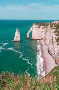 Steep chalk cliffs of Etretat in Normandy Stock Photos