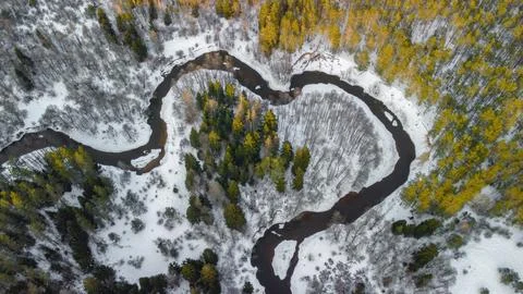 Steep cliff and loops of the Ūla River, heart-shaped, from above, winter 스톡 사진
