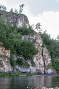Steep cliffs on the Ai river during the rafting Stock Photos