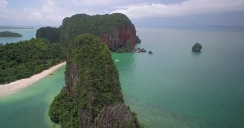 Steep Cliffs and Rugged Coastline at Railay, Krabi, Thailand, Aerial Pan Shot Stock Footage 76489569
