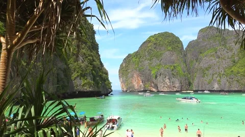 Steep cliffs and tropical vegetation around the idyllic Maya Bay Video stock 290456816