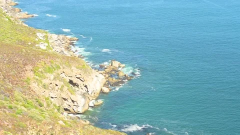 Steep cliffs and turquoise sea at the Cape of Good Hope in South Africa Stock Footage 237739032