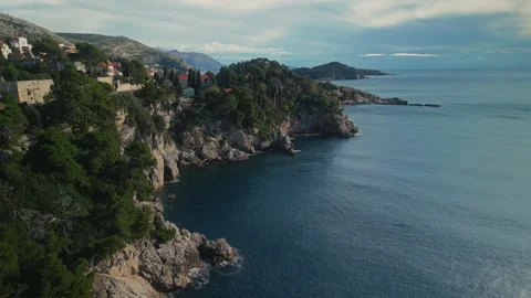Steep cliffs with pine forest and modern highway near touristic Dubrovnik town Video stock 307409485