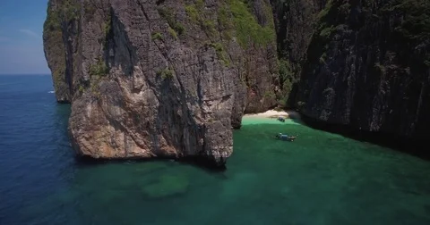 Steep Cliffs Surrounding Small Beach on Maya Bay, Phi Phi Leh, Thailand Stock Footage 73585394