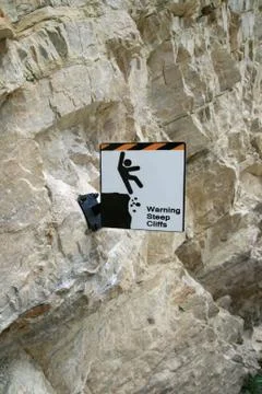 Steep cliffs warning sign Stock Photos