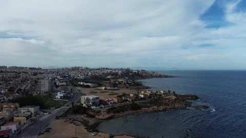 Steep Cliffside and Waterfront Drone Footage Vídeos de archivo 307702601