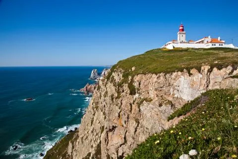 Steep coast at lighthouse cabo da roca Stock Photos