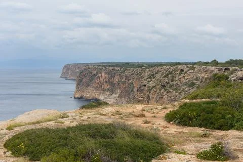 Steep coastal cliffs at Cap Blanc in Mallorca, Spain. Stock Photos