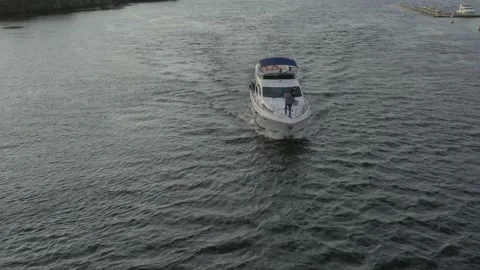 Steep flyby of a yacht quickly moving along the Dnieper River Stock Footage 195681802