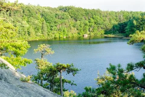 Steep granite hillside overlooking Long Pond Stock Photos