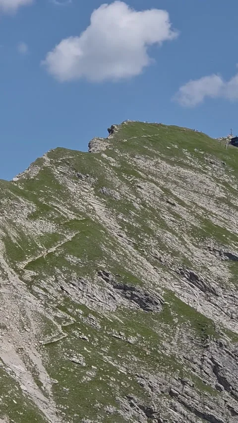 Steep grassy limestone ridges under a blue summer sky, Allgäu Alps Stock-Footage 346368139