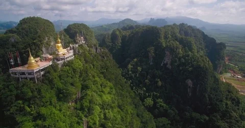 Steep Limestone Cliff With Buddha Statue On Top, Krabi, Thailand, Ascending Stock Footage 79048089