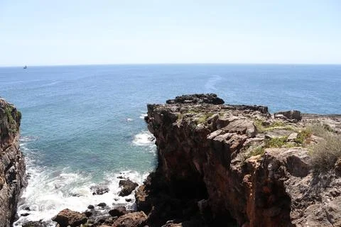 Steep limestone cliff overlooking the Atlantic Ocean in Cascais. Stock Photos